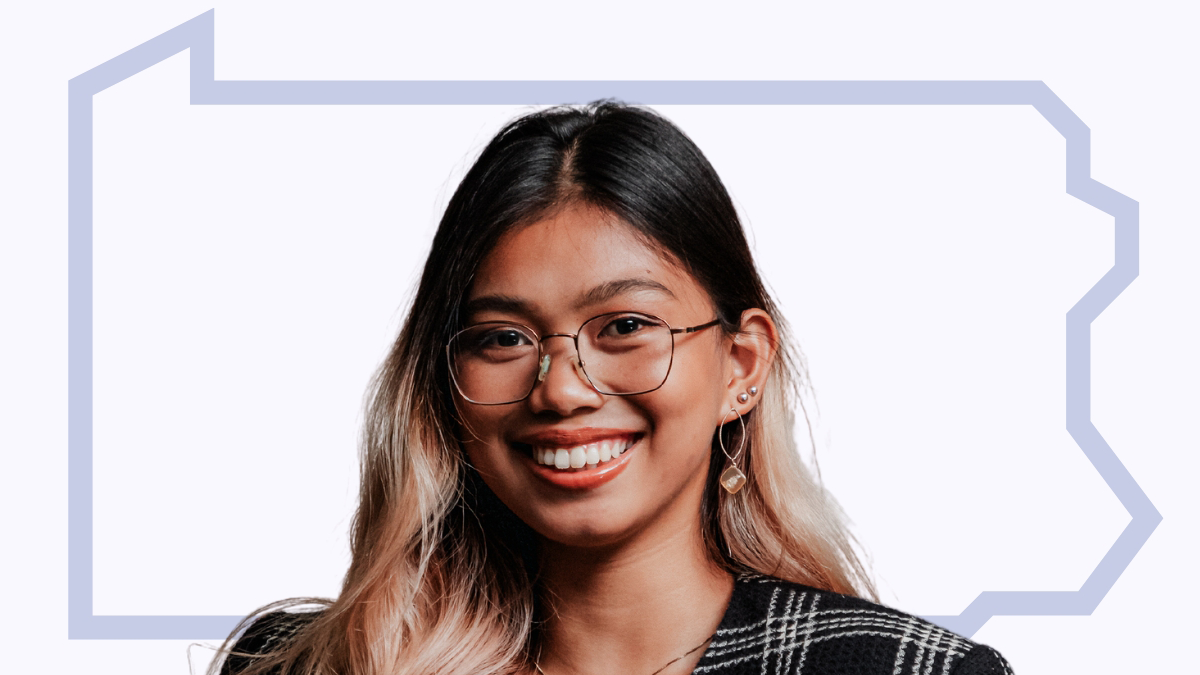 A woman smiling with the PA outline surrounding her.