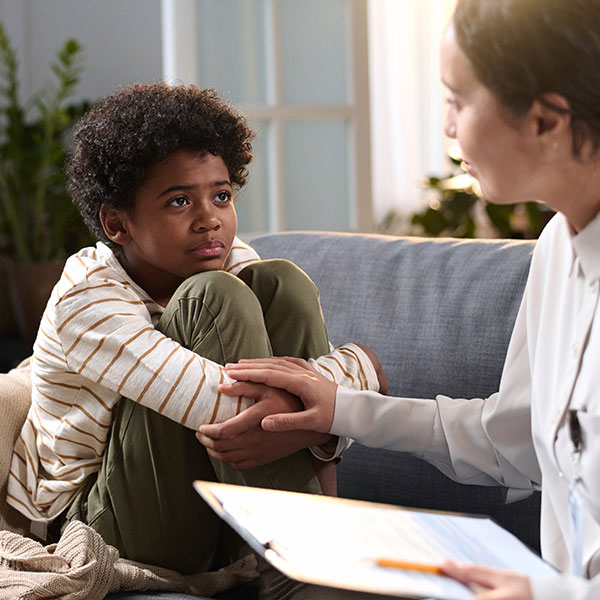 A counselor comforting a child.