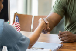 Vet shaking hand