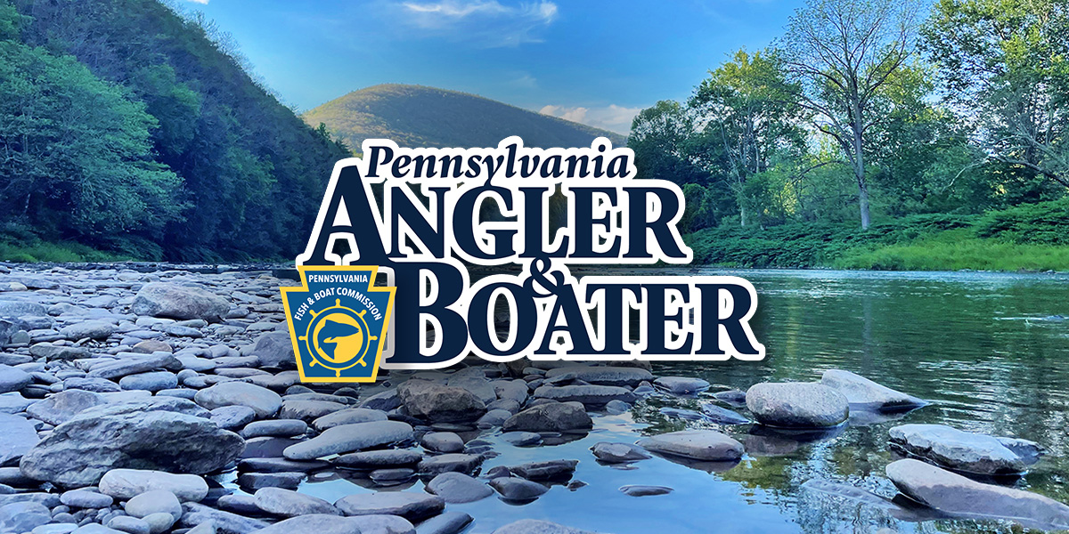 Pennsylvania Angler & Boater Magazine logo over a photo of a scenic waterway with a mountain in the background.