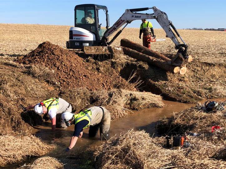 Photo of PFBC and partners excavating and restoring habitat to a stream in the Turtle Creek Watershed, PA.