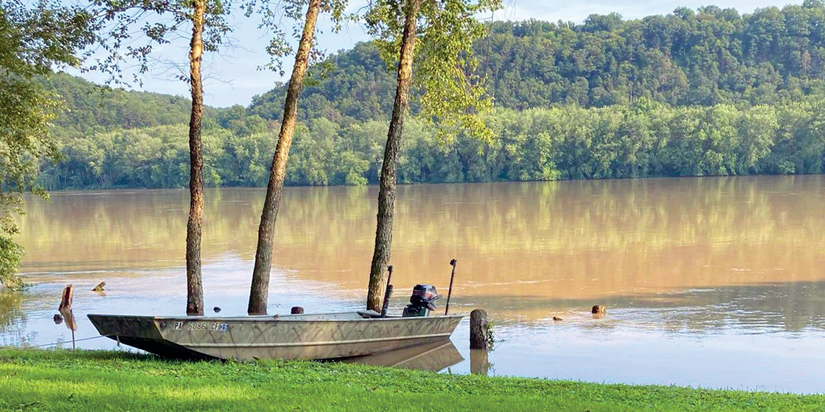 Wide shot of a boat moored on the shoreline of the Susquehanna River in Southcentral, PA.