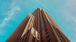 The top of a tall building and sky