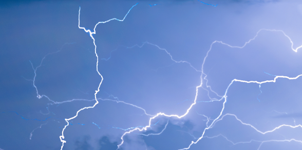 Lightning lights up a stormy sky.