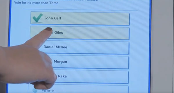 Person making selections on the ballot marking device touchscreen