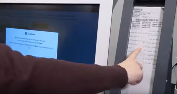 Person reviewing their selections before submitting the ballot
