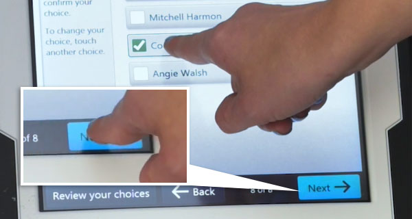Person making selections on the ballot marking device touchscreen